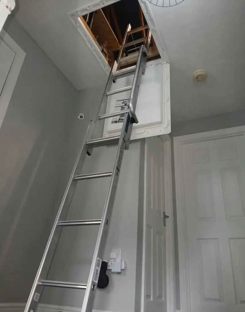 Insulated loft hatch fitted into the ceiling