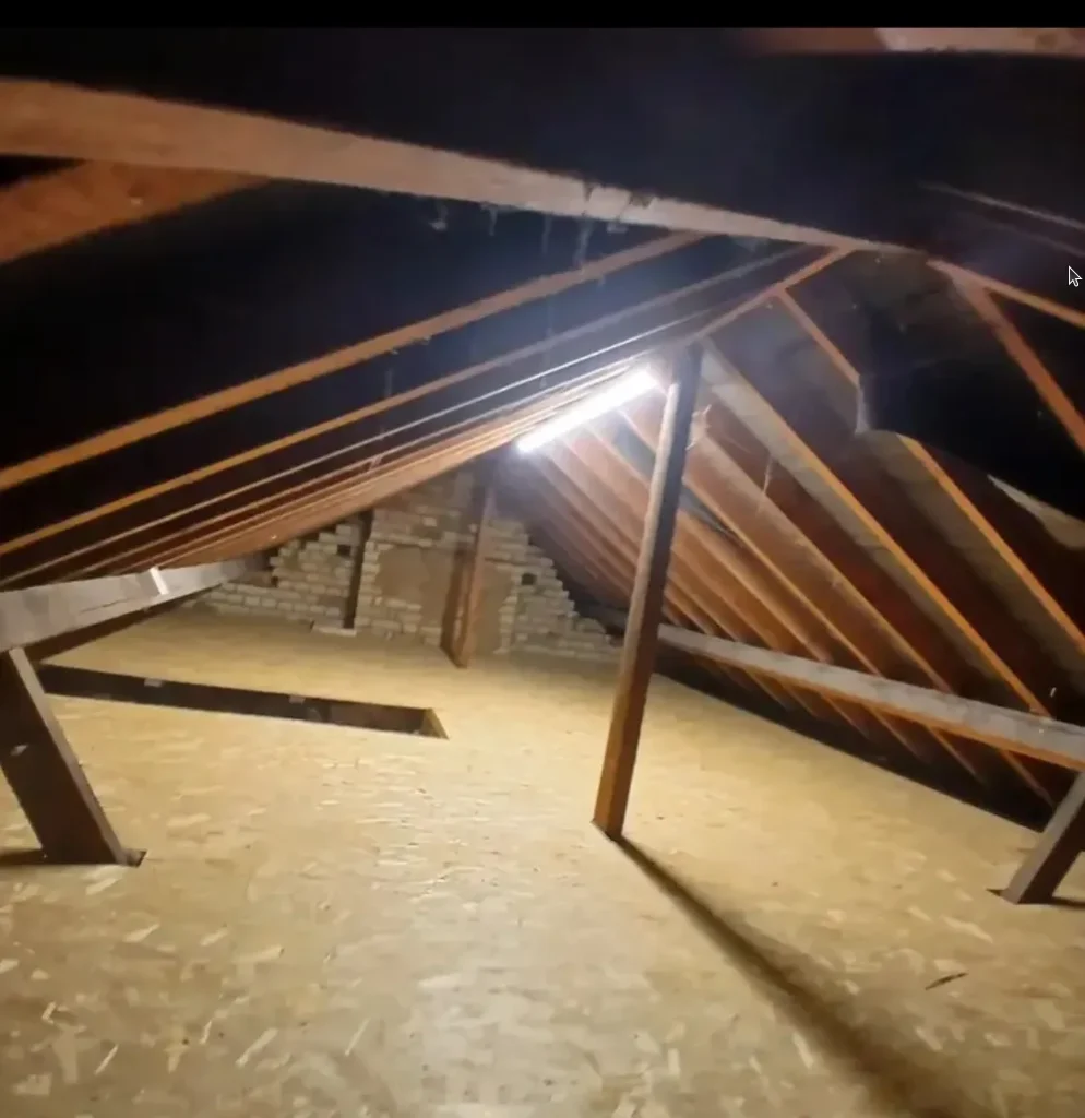 Aluminium loft ladder fitted to a boarded loft