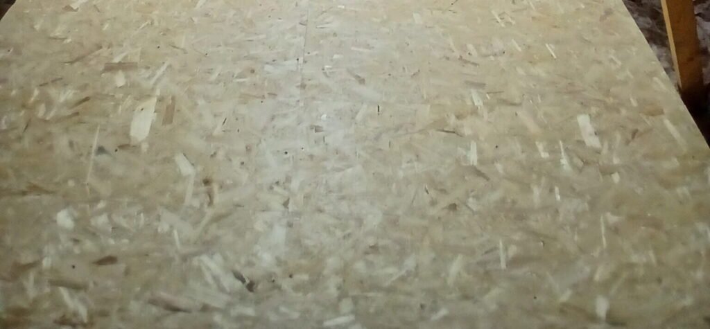 Finished loft storage area with boxes stored on raised boards